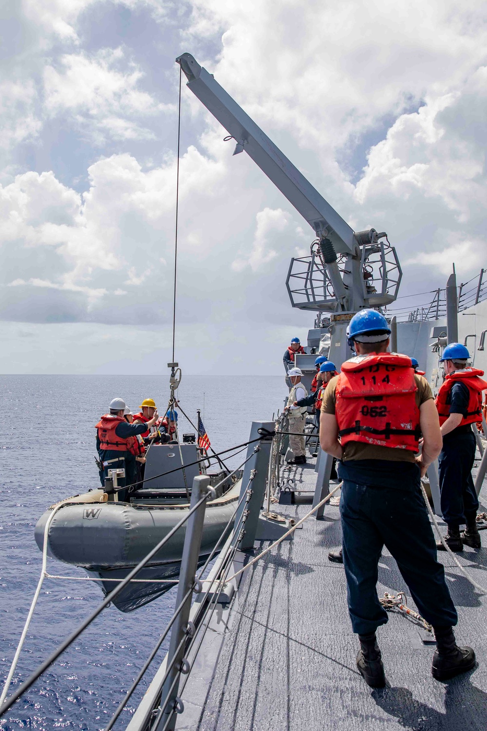 Sailors conduct small boat operations aboard USS Ralph Johnson (DDG 114), 29 June.