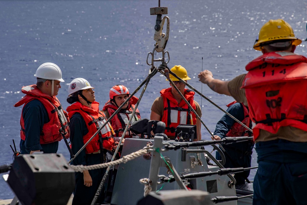 Sailors conduct small boat operations aboard USS Ralph Johnson (DDG 114), 29 June.