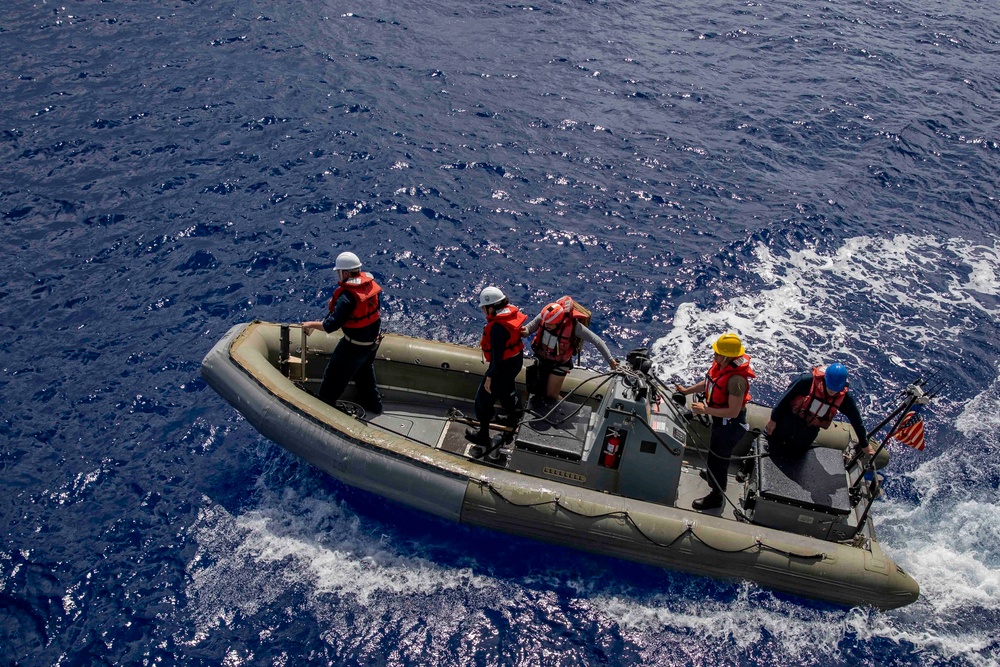 Sailors conduct small boat operations aboard USS Ralph Johnson (DDG 114), 29 June.
