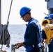 USS Robert Smalls (CG 62) Sailor Removes Life Lines before UNREP