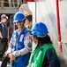 USS Robert Smalls (CG 62) Sailor Converses with Philippine Navy sailor during UNREP