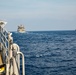 USS Robert Smalls (CG 62) Sails alongside USNS Carl Brashear (T-AKE 7) and USS Rafael Peralta (DDG 115)