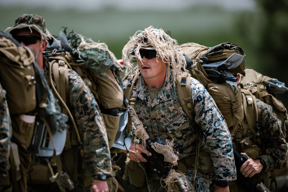 U.S. Marines with 2/23 conduct a conditioning hike during Mountain Exercise 4-23