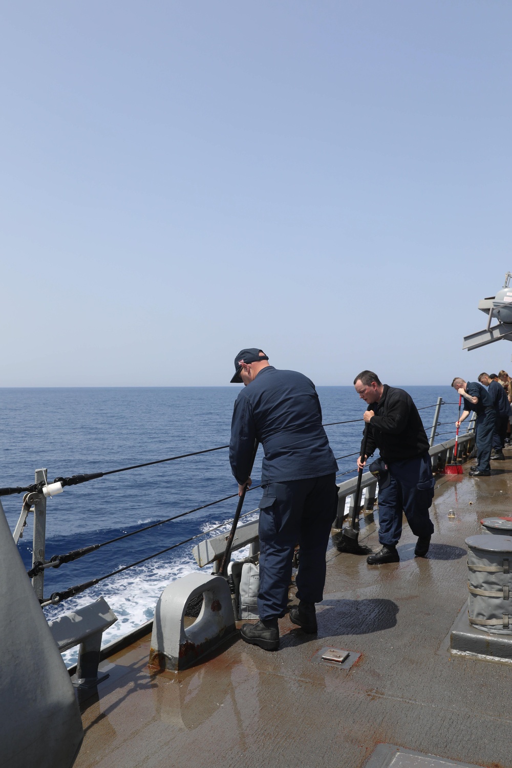 Sailors Sweeping The Deck