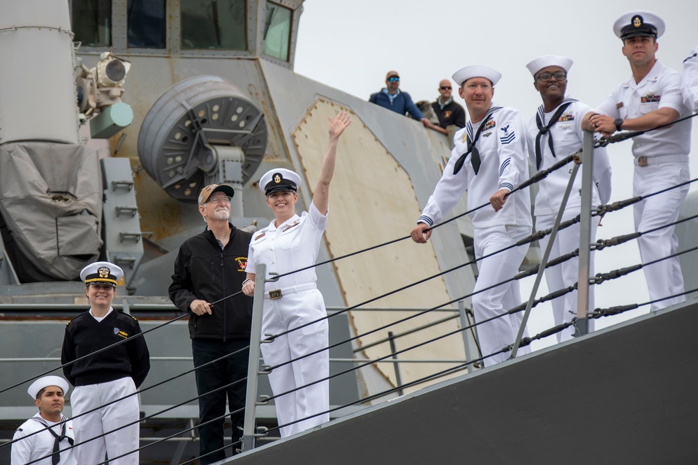 USS Decatur Crew Members Wave to Friends and Family While Arriving Pierside from Deployment