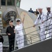 USS Decatur Crew Members Wave to Friends and Family While Arriving Pierside from Deployment