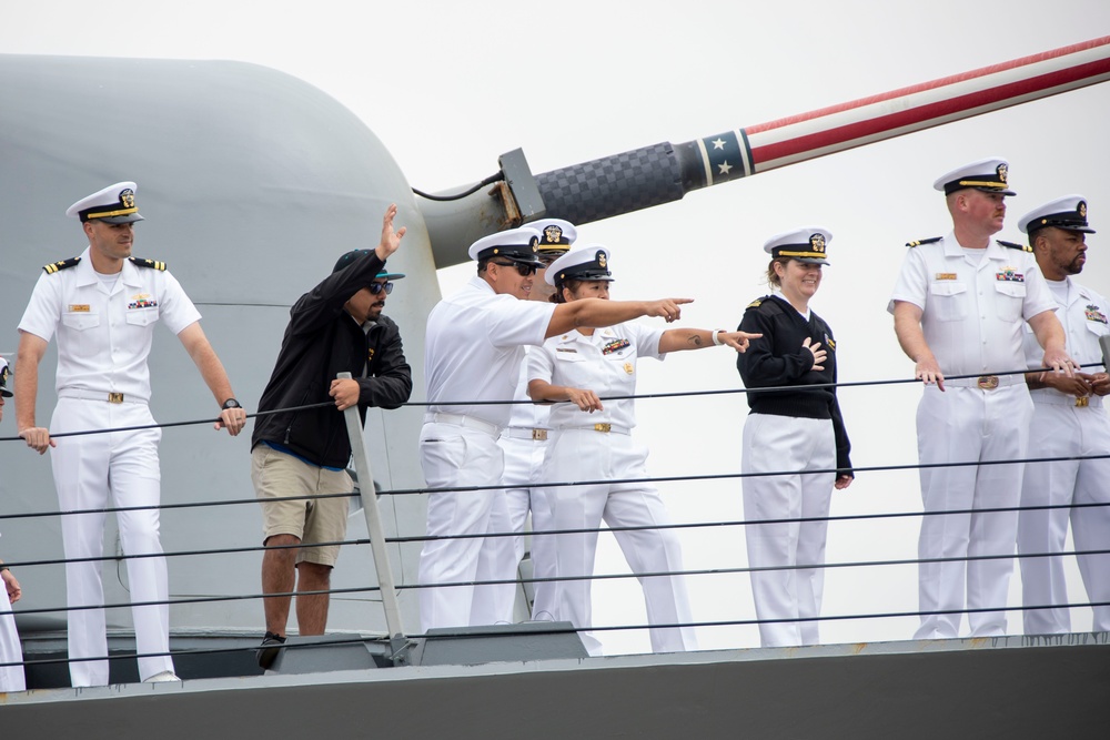 USS Decatur Crew Members Wave to Friends and Family While Arriving Pierside from Deployment