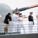 USS Decatur Crew Members Wave to Friends and Family While Arriving Pierside from Deployment