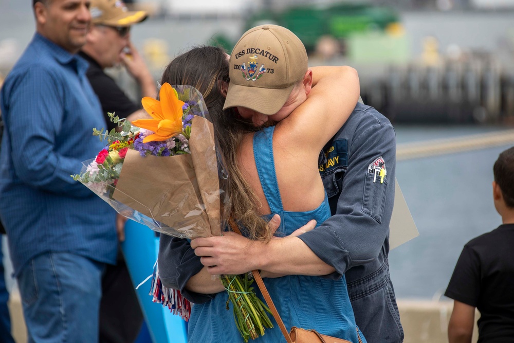 USS Decatur Sailor Embraces His Wife After Returning from Deployment