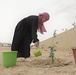 A Ma3an Youth Leader planting a tree during a planting campaign in Metlaoui, Gafsa