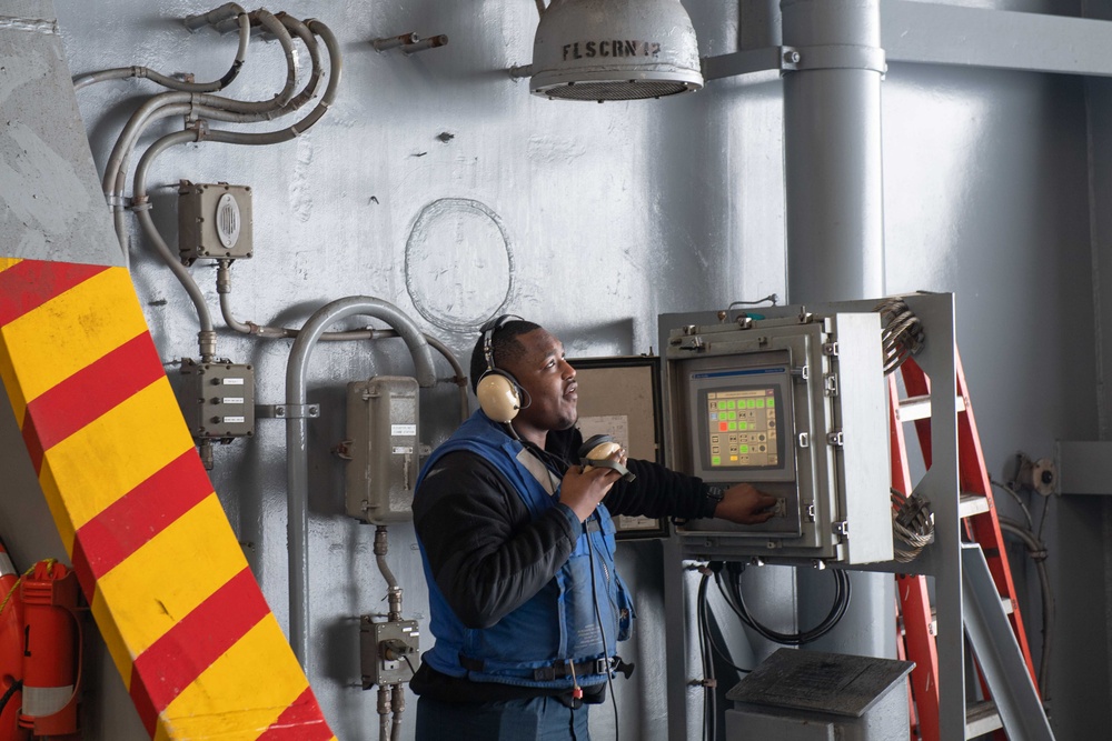 USS Theodore Roosevelt (CVN 71) Sailor perform a sprinkler check.