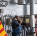 USS Theodore Roosevelt (CVN 71) Sailor perform a sprinkler check.