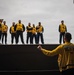 USS Theodore Roosevelt (CVN 71) Sailor perform a sprinkler check.