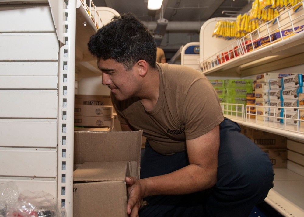 USS Theodore Roosevelt (CVN 71) Sailor perform a sprinkler check.