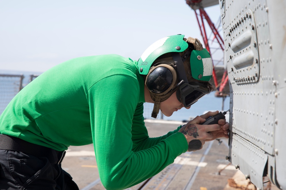 Sailor Performs Maintenance on MH-60R Sea Hawk