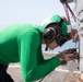 Sailor Performs Maintenance on MH-60R Sea Hawk