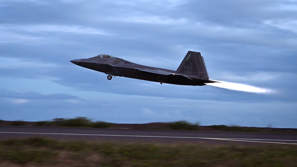 When Darkness Meets Power: Hawaii F-22s Chase the Sunset