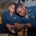 USS Ronald Reagan (CVN 76) Sailors maintain aircraft towing tractors