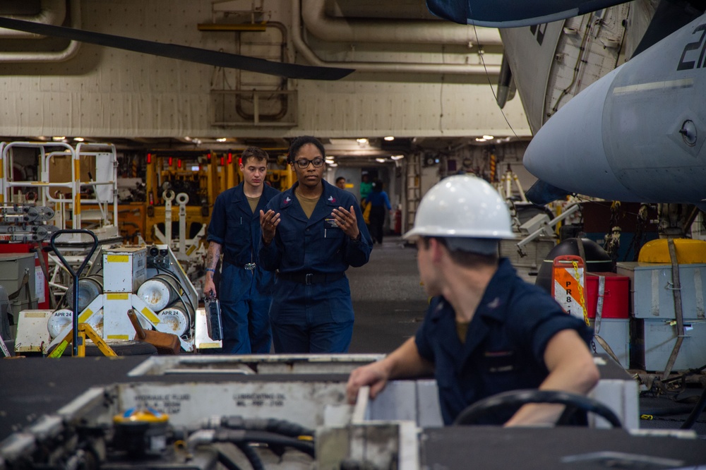 USS Ronald Reagan (CVN 76) Sailors maintain aircraft towing tractors
