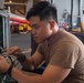 USS Ronald Reagan (CVN 76) Sailors maintain aircraft towing tractors