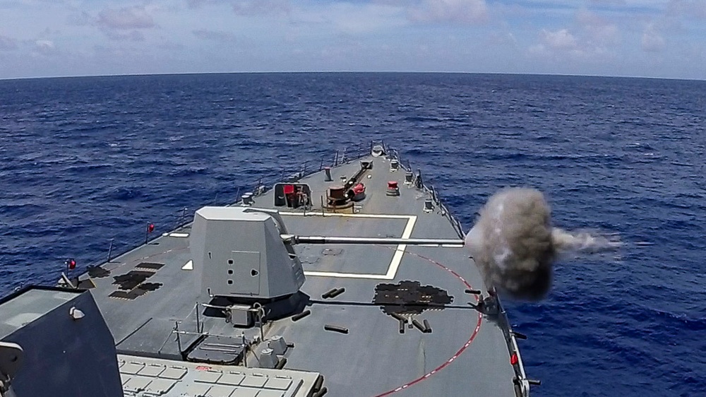 Arleigh Burke-class guided-missile destroyer USS Ralph Johnson (DDG 114) conducts a live fire exercise in the Philippine Sea, July 1.