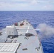 Arleigh Burke-class guided-missile destroyer USS Ralph Johnson (DDG 114) conducts a live fire exercise in the Philippine Sea, July 1.