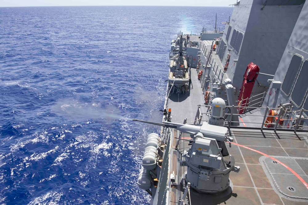 Arleigh Burke-class guided-missile destroyer USS Ralph Johnson (DDG 114) conducts a live fire exercise in the Philippine Sea, July 1.