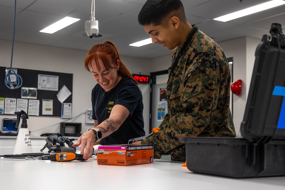 U.S. Marines and Australian Airmen Maintain Joint Strike Fighter Equipment together