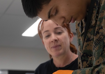 U.S. Marines and Australian Airmen Maintain Joint Strike Fighter Equipment together