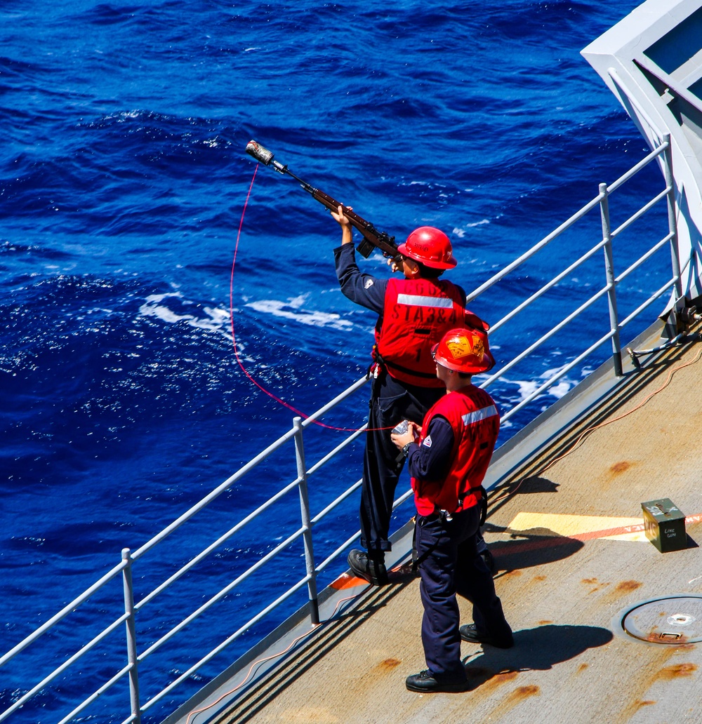 USS Robert Smalls (CG 62) Sailor Shoots Shot Line during RAS