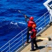 USS Robert Smalls (CG 62) Sailor Shoots Shot Line during RAS