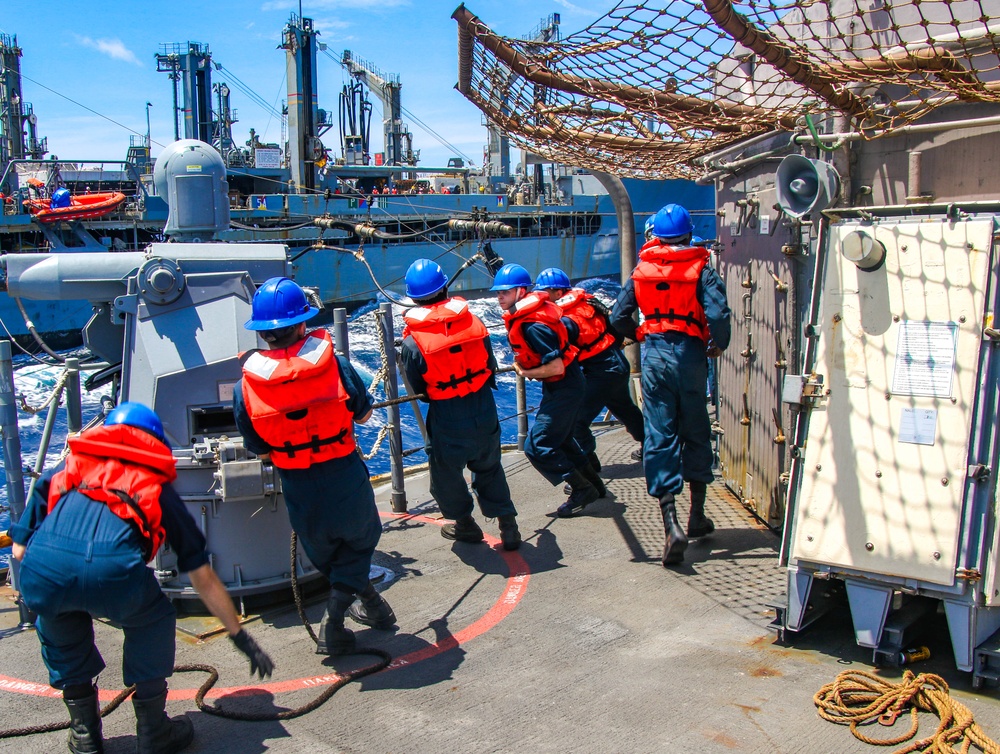 USS Robert Smalls (CG 62) Sailors Run the Line during RAS