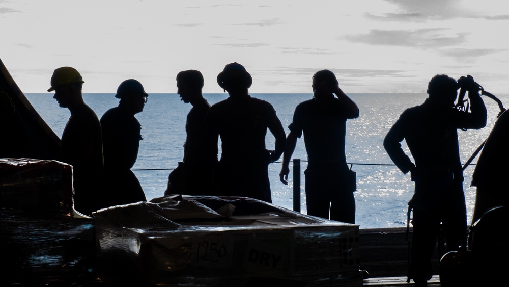 USS Ronald Reagan (CVN 76) Sailors transport cargo during a replenishment-at-sea