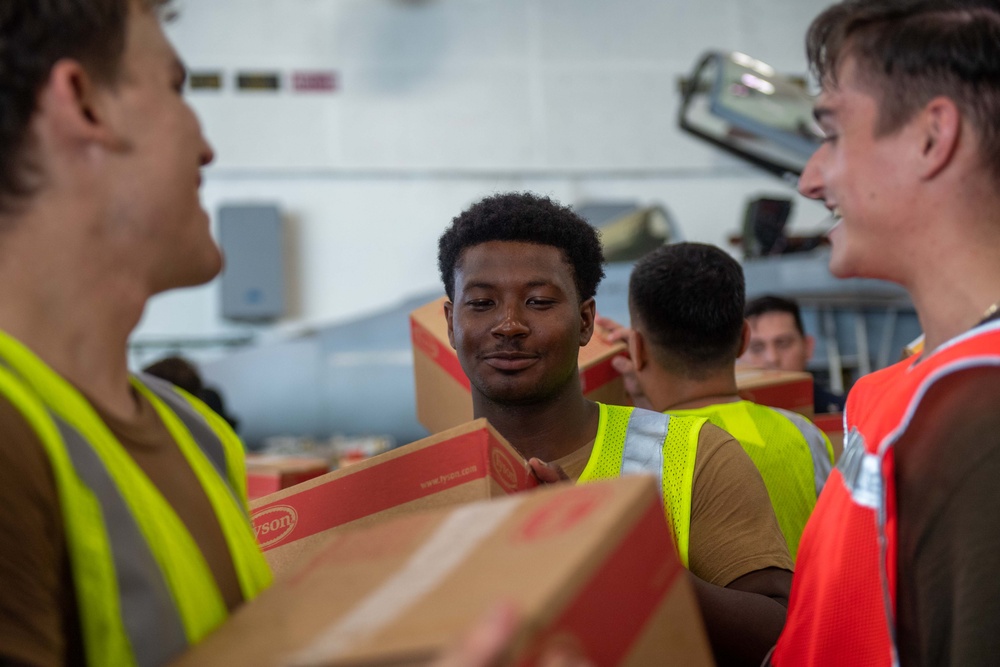 USS Ronald Reagan (CVN 76) Sailors transport cargo during a replenishment-at-sea