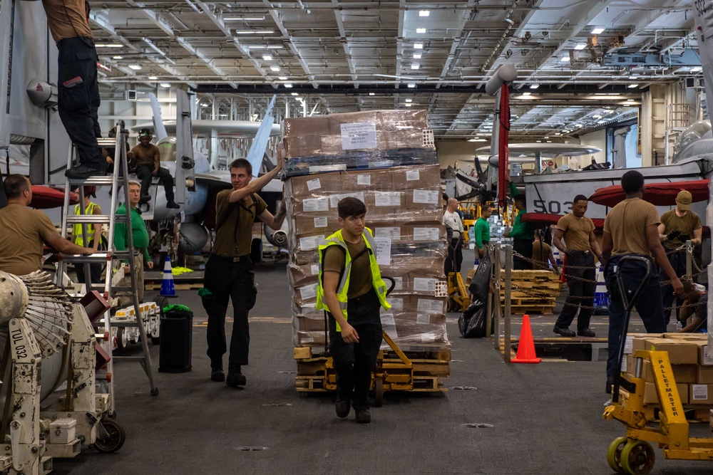 USS Ronald Reagan (CVN 76) Sailors transport cargo during a replenishment-at-sea