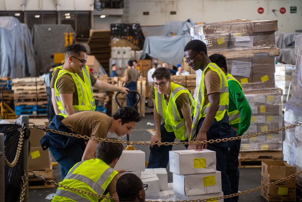 USS Ronald Reagan (CVN 76) Sailors transport cargo during a replenishment-at-sea