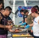 USS Ralph Johnson (DDG 114) Sailors enjoy a steel beach picnic on the ship’s flight deck to celebrate Independence Day in the Philippine Sea, July 4.