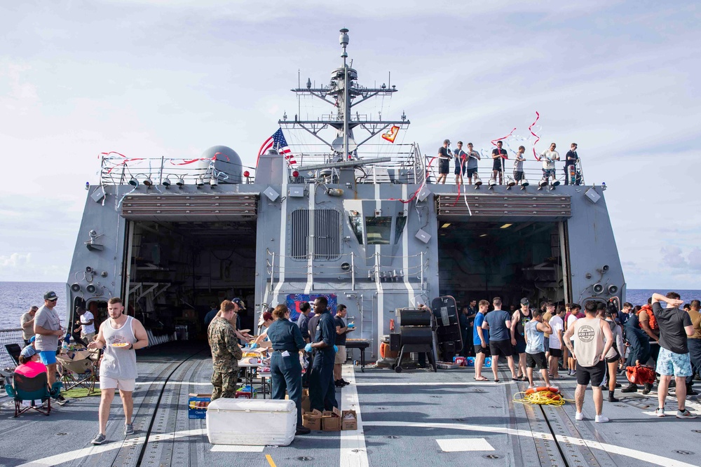 USS Ralph Johnson (DDG 114) Sailors enjoy a steel beach picnic on the ship’s flight deck to celebrate Independence Day in the Philippine Sea, July 4.