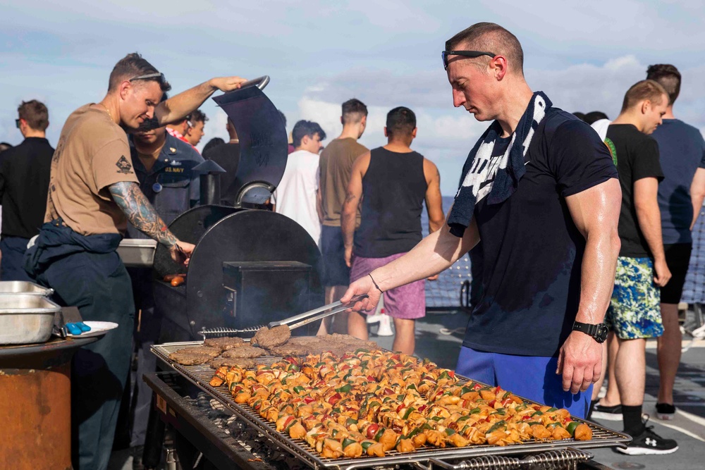 USS Ralph Johnson (DDG 114) Sailors enjoy a steel beach picnic on the ship’s flight deck to celebrate Independence Day in the Philippine Sea, July 4.