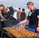 USS Ralph Johnson (DDG 114) Sailors enjoy a steel beach picnic on the ship’s flight deck to celebrate Independence Day in the Philippine Sea, July 4.