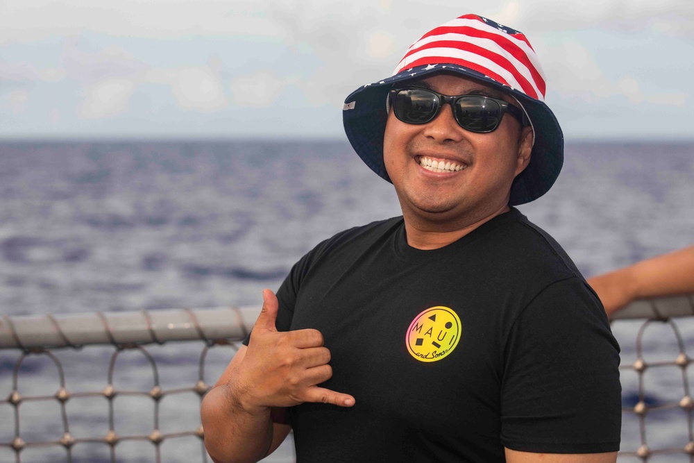 USS Ralph Johnson (DDG 114) Sailors enjoy a steel beach picnic on the ship’s flight deck to celebrate Independence Day in the Philippine Sea, July 4.