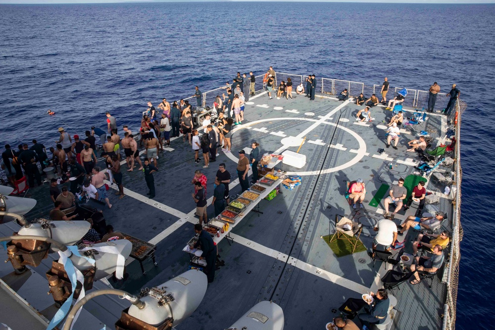 USS Ralph Johnson (DDG 114) Sailors enjoy a steel beach picnic on the ship’s flight deck to celebrate Independence Day in the Philippine Sea, July 4.