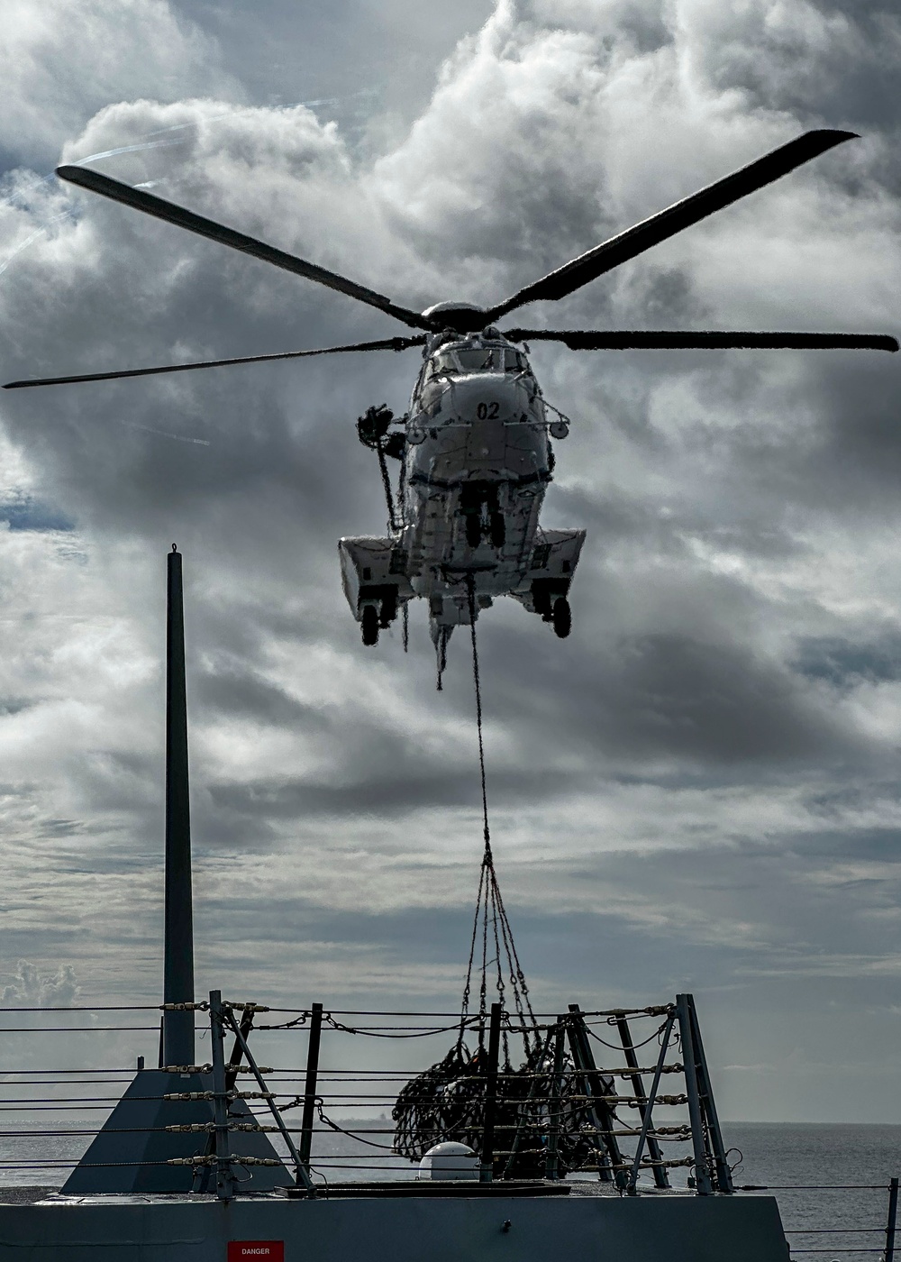 USS Rafael Peralta (DDG 115) conducts a vertical replenishment-at-sea with the Military Sealift Command fleet replenishment oiler USNS Carl Brashear (T-AKE 7)