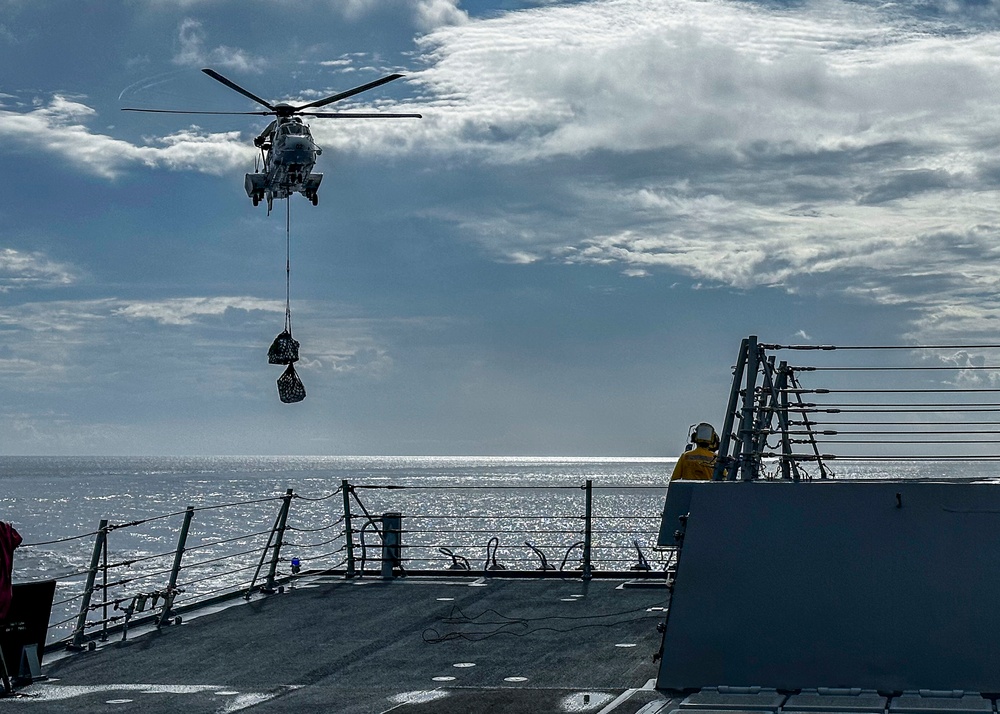 USS Rafael Peralta (DDG 115) conducts a vertical replenishment-at-sea with the Military Sealift Command fleet replenishment oiler USNS Carl Brashear (T-AKE 7)