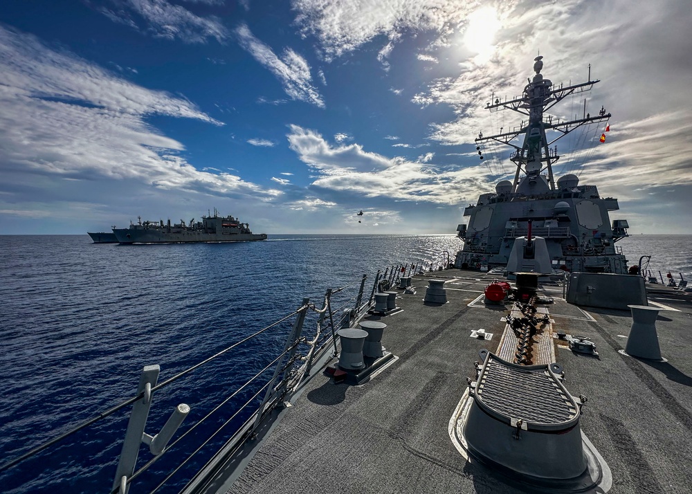 USS Rafael Peralta (DDG 115) conducts a vertical replenishment-at-sea with the Military Sealift Command fleet replenishment oiler USNS Carl Brashear (T-AKE 7)