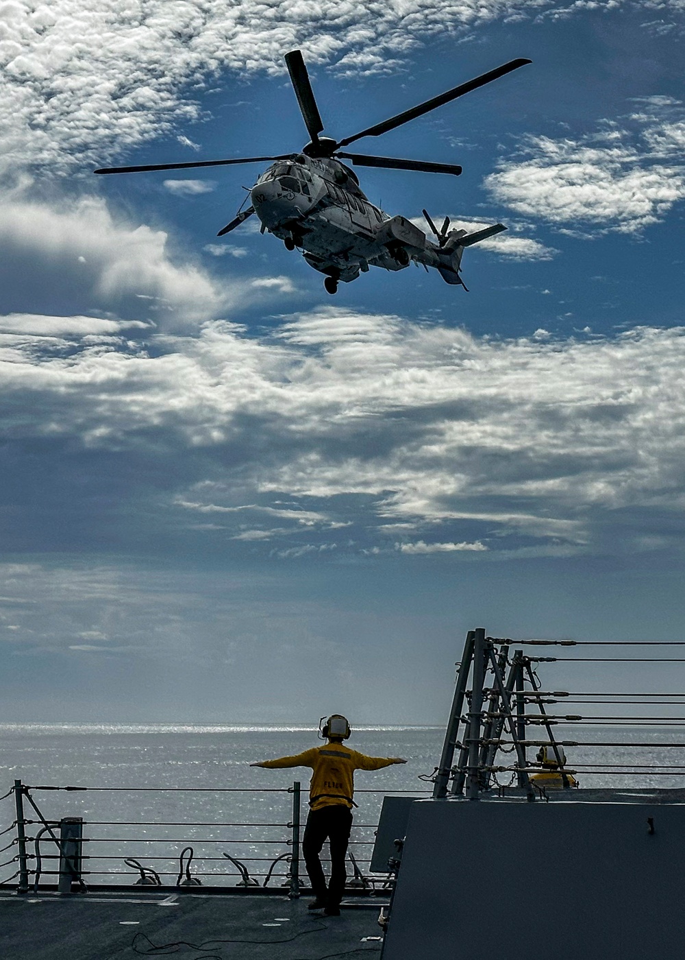 USS Rafael Peralta (DDG 115) conducts a vertical replenishment-at-sea with the Military Sealift Command fleet replenishment oiler USNS Carl Brashear (T-AKE 7)