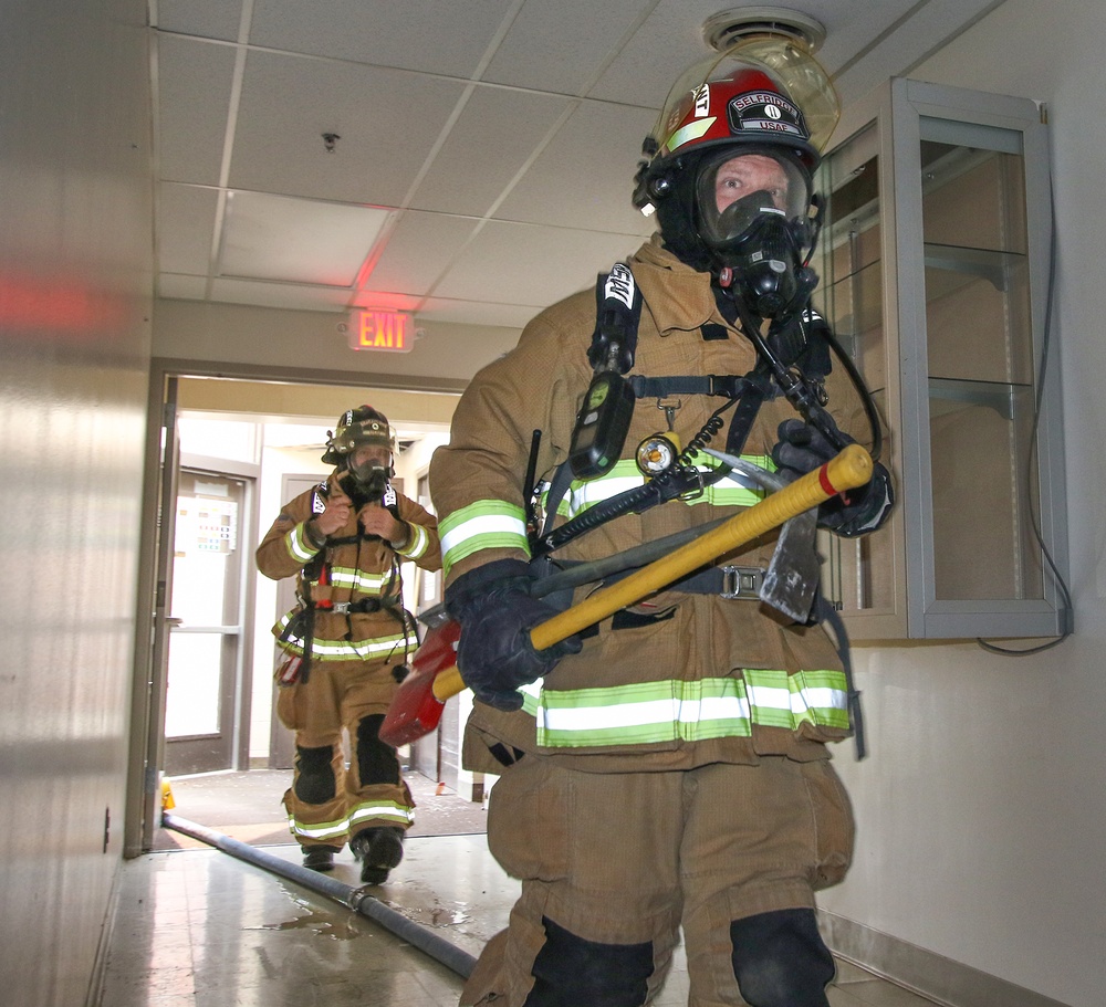 Selfridge Firefighters Train in Realistic Scenarios Inside Hangar Under Demolition.