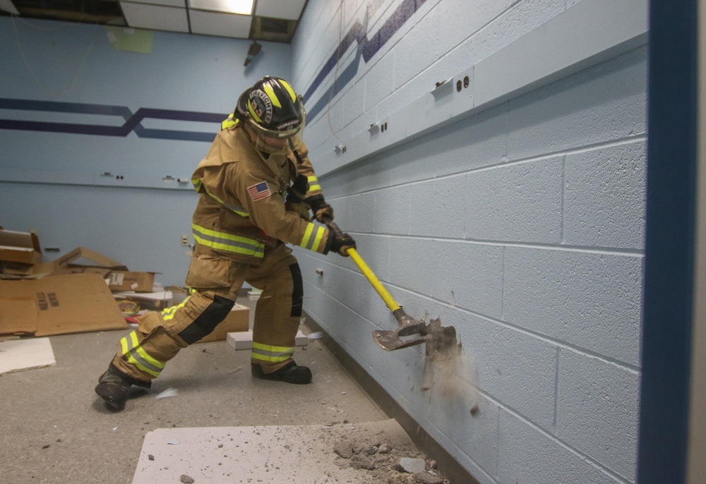 Selfridge Firefighters Train in Realistic Scenarios Inside Hangar Under Planned Demolition.