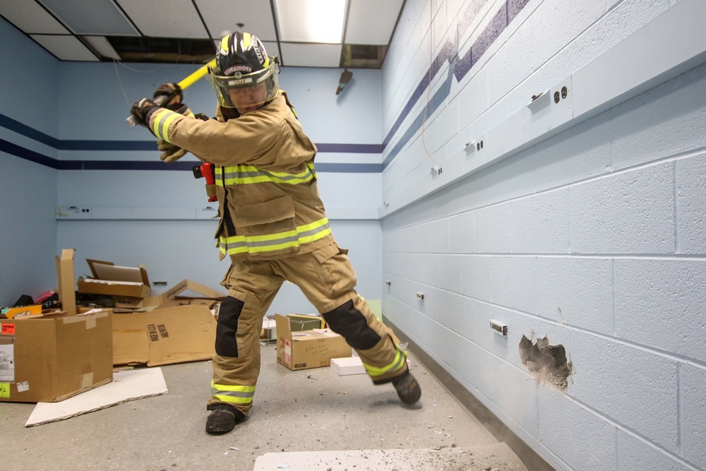 Selfridge Firefighters Train in Realistic Scenarios Inside Hangar Under Demolition.