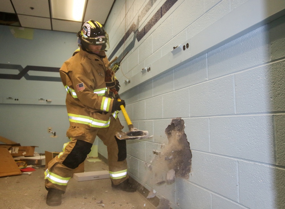 Selfridge Firefighters Train in Realistic Scenarios Inside Hangar Under Demolition.